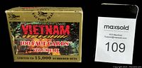 Gold colored rectangular box labeled 'Vietnam 100 Fact Cards Volume II' front view with text about limited edition and factory seal.