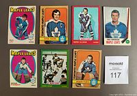 Front view of 7 Toronto Maple Leafs hockey cards from late 1960s and early 1970s showing player portraits and team branding.