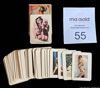 Photo showing original box and spread of cards with miniature model images in full color.