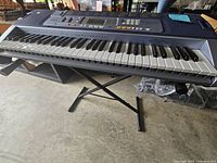 Side angle showing keyboard on stand, keys, and overall keyboard shape.
