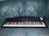 Front angled view of the Casio CTK-510 keyboard showing the full 61 keys, speakers on each side, and control buttons on the top panel.