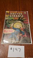 Front cover of Doctor Strange Strange Tales #164 comic book showing colorful artwork and title, sealed in plastic.