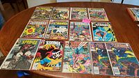 14 Dr. Strange comic book issues laid out on a table showing various cover art from Bronze Age and newer issues.