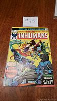 Front cover of The Inhumans #1 comic showing colorful characters and original price 25 cents with 'First Issue!' banner