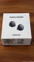 Front top view of the Samsung Galaxy Buds2 retail box showing image of earbuds and Samsung branding.