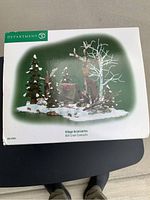 Original box of Mill Creek Campsite village accessories showing a winter campsite scene including trees, campfire, snow, and natural elements.
