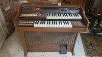 Full view of Bontempi electric organ showing keyboard, control buttons, wood-grain finish, and foot pedal.
