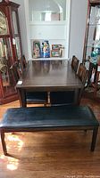 Full view of dining table set including table, 4 chairs, and bench on hardwood floor