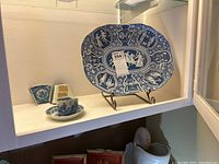 Overview showing Copeland & Garrett platter on stand, Mason's cup and saucer, broken platter fragment