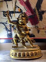 Front three-quarter view of statue
