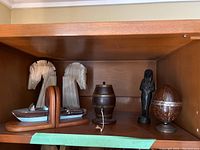 Wide view showing all five items on a shelf