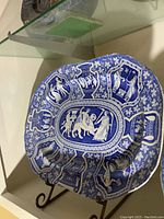 Front view of platter on stand showing overall pattern and shape