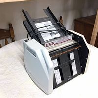 Full view of Martin Yale AutoFolder showing the input hopper and folding mechanism.