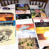Overview photo showing 15 vinyl records arranged on a table featuring various artists including Neil Diamond, Luciano Pavarotti, Frank Sinatra, Richard Clayderman, Roger Williams, classical guitar records, and choir music albums.