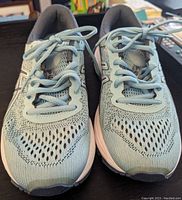 Front view of turquoise and grey Ryka running shoes pair showing mesh upper and lace-up design