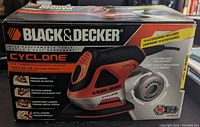 Box of Black & Decker Cyclone 4-in-1 sander showing brand and features