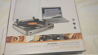 Front of boxed Audio-Technica USB turntable showing product image and brand.
