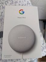Image of Google Nest Mini 2nd generation box showing product image and branding.