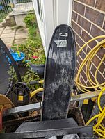 Photo of the bottom side black plastic runner showing wear.