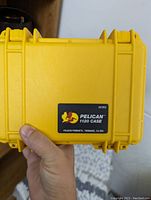 Front view of the Pelican yellow case showing model number label '1120 CASE'.