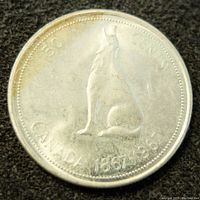 Obverse side showing a howling wolf and the inscriptions 50 CENTS CANADA 1867-1967