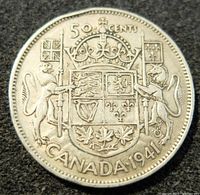 Reverse view of the 1941 Canadian 50 cents silver coin with coat of arms, denomination, and date.