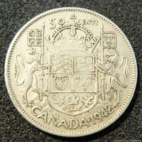 Obverse side showing the shield with flags and denomination with date 'Canada 1942'.