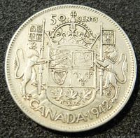Reverse of the 1942 Canadian 50 cent silver coin showing Canadian coat of arms, denomination, and circulation year.