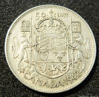 Reverse of 1942 Canadian 50 cents silver coin showing Royal Canadian Arms with crown, lion, unicorn, and denomination/date markings.