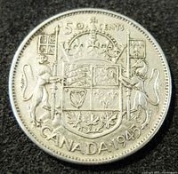 Reverse side of the 1943 silver Canadian 50 cents coin displaying the coat of arms, denomination, and year.