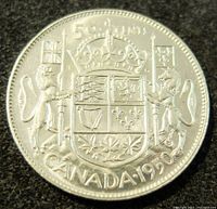 Reverse side of 1950 Canadian 50 cents silver coin showing crowned shield of arms and inscriptions.