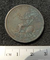 Reverse side of the 1799 George III half penny coin depicting seated Britannia with trident and shield.