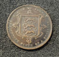 Front side of the antique 1870 States of Jersey coin showing the shield with three lions passant and denomination text.