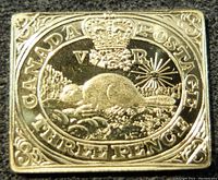 Front view showing detailed beaver design with crown and inscriptions.