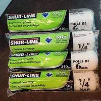 Four SHUR-LINE paint rollers showing brand label, size 240mm, 9.5 inch, different nap lengths (6mm and 1/4 inch).