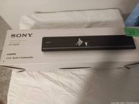 Photo of boxed Sony HT-S200F sound bar from the top angle showing brand and model number.
