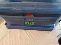 Stack of three blue Rubbermaid Studio underbed storage containers