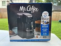 Front-facing photo of the Mr. Coffee single cup coffee maker box showing product features and images.