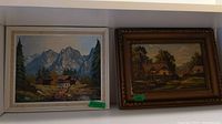 Two framed oil paintings side by side showing both lot items
