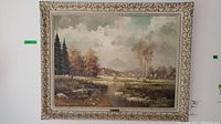 Full frontal view of the framed oil painting showing landscape scene