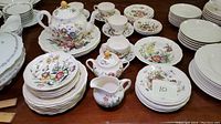 Full view of tea service and various plates and bowls in Raeburn floral pattern