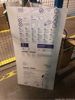 Full front view of sheet with protective label and graphics