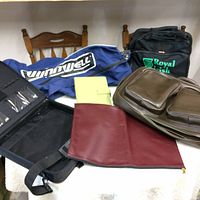 Photo of all bags and cases displayed on table showing their condition and features