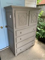 Full view of the chest showing its overall design and condition from a front angle.