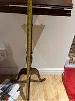 Side view showing the height measurement of the wooden stand approximately 33 inches.