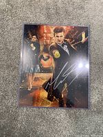 Signed Doctor Who photo with Matt Smith and Jenna Coleman characters in action poses, showing autograph clearly.