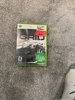 Xbox 360 game case for Grid with cover art and trade sticker