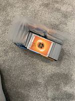 Stack of Star Wars Chrome trading cards in protective sleeves, showing varied card backs and some card fronts with character imagery.