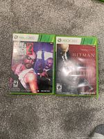 Photo of two Xbox 360 game cases: Kane & Lynch 2: Dog Days and Hitman: Absolution