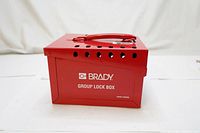 Front and side view of red metal lock box with handle and padlock holes